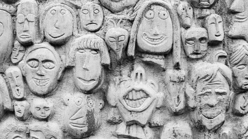 Photograph of stone carved faces.